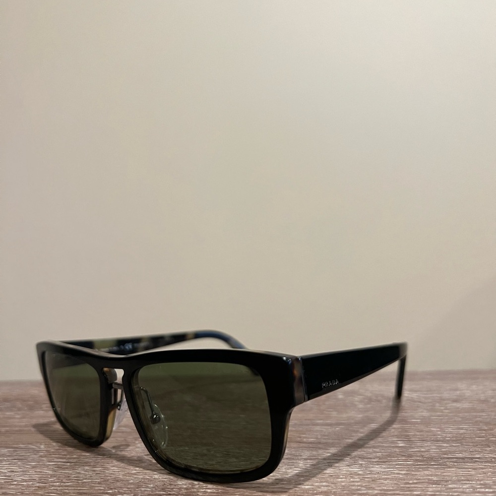 Prada sunglasses, black with slight green undertones. Excellent condition!
